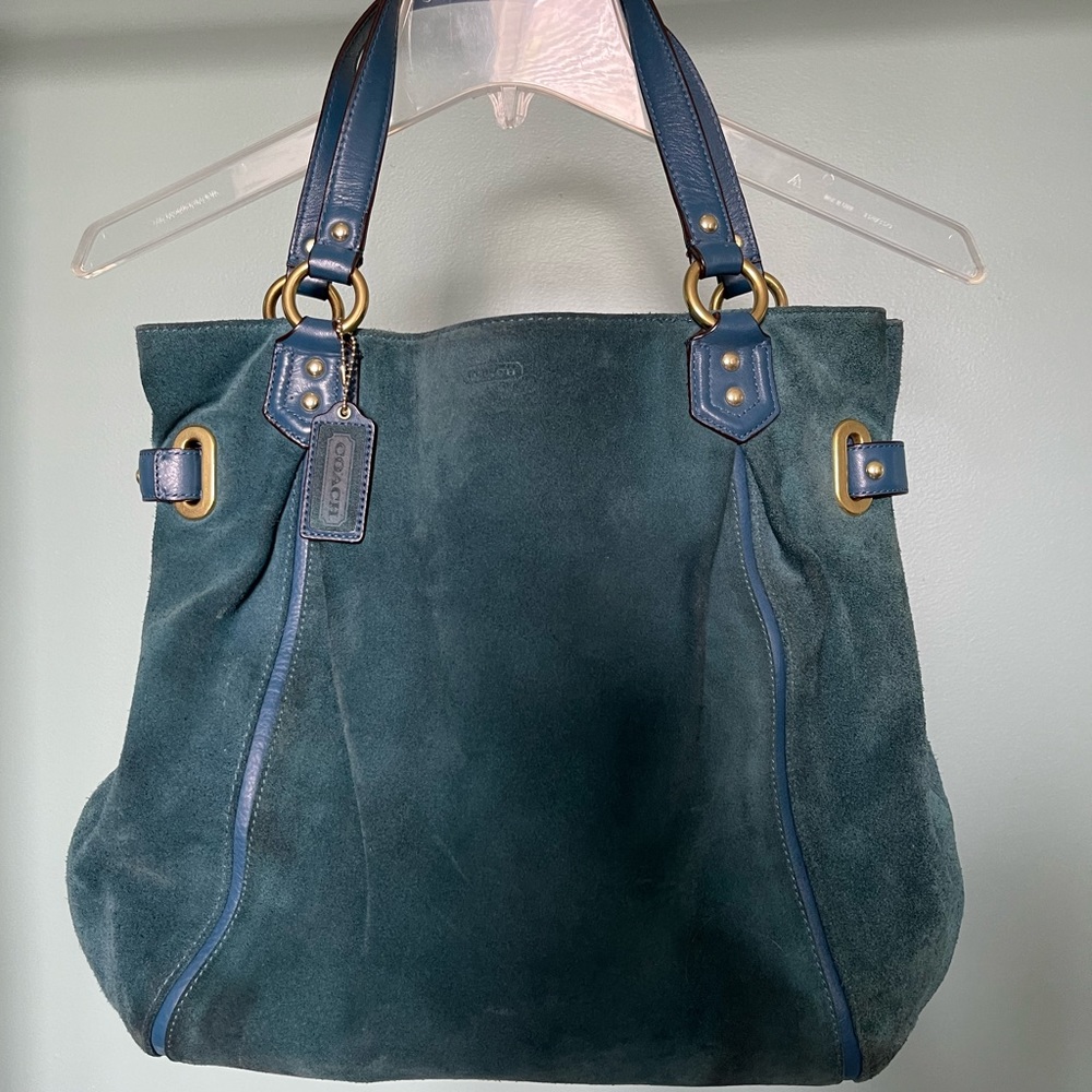 Blue suede Coach shoulder bag with gold accents in good condition.